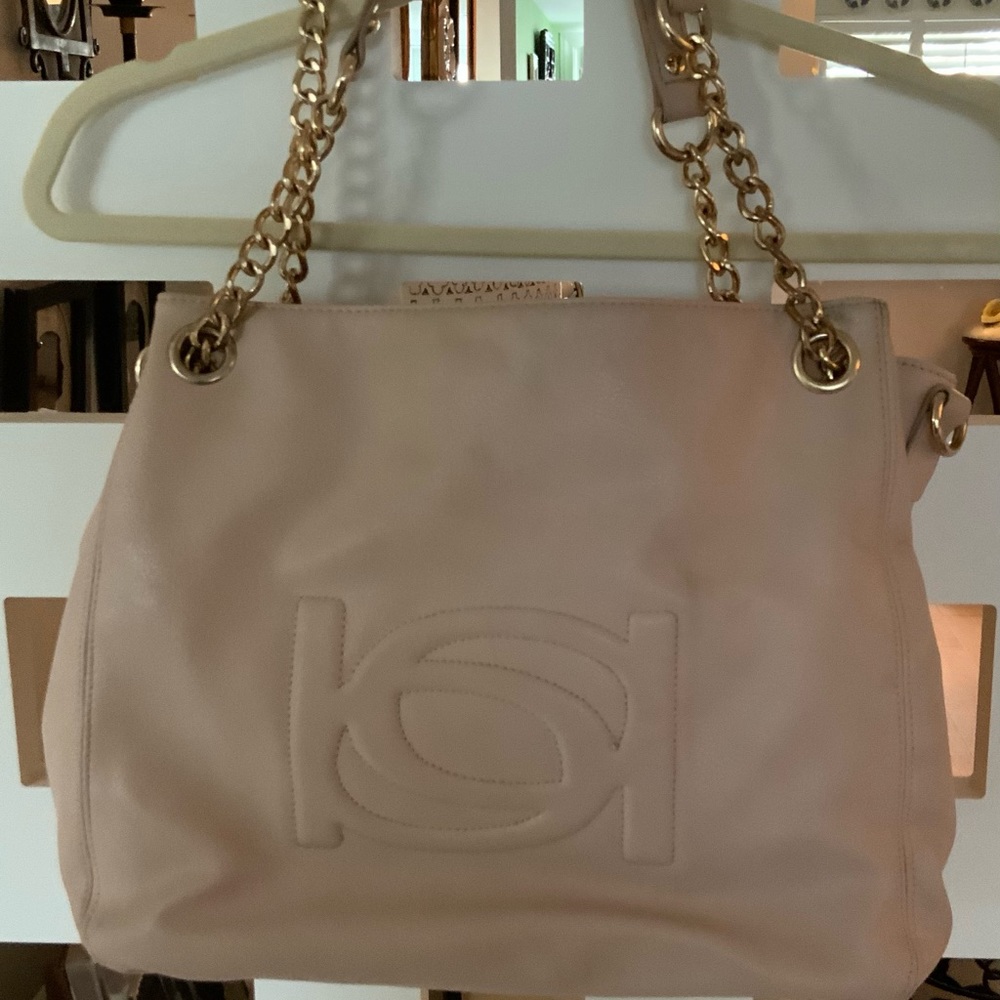 Blush colored hand bag. Good condition.